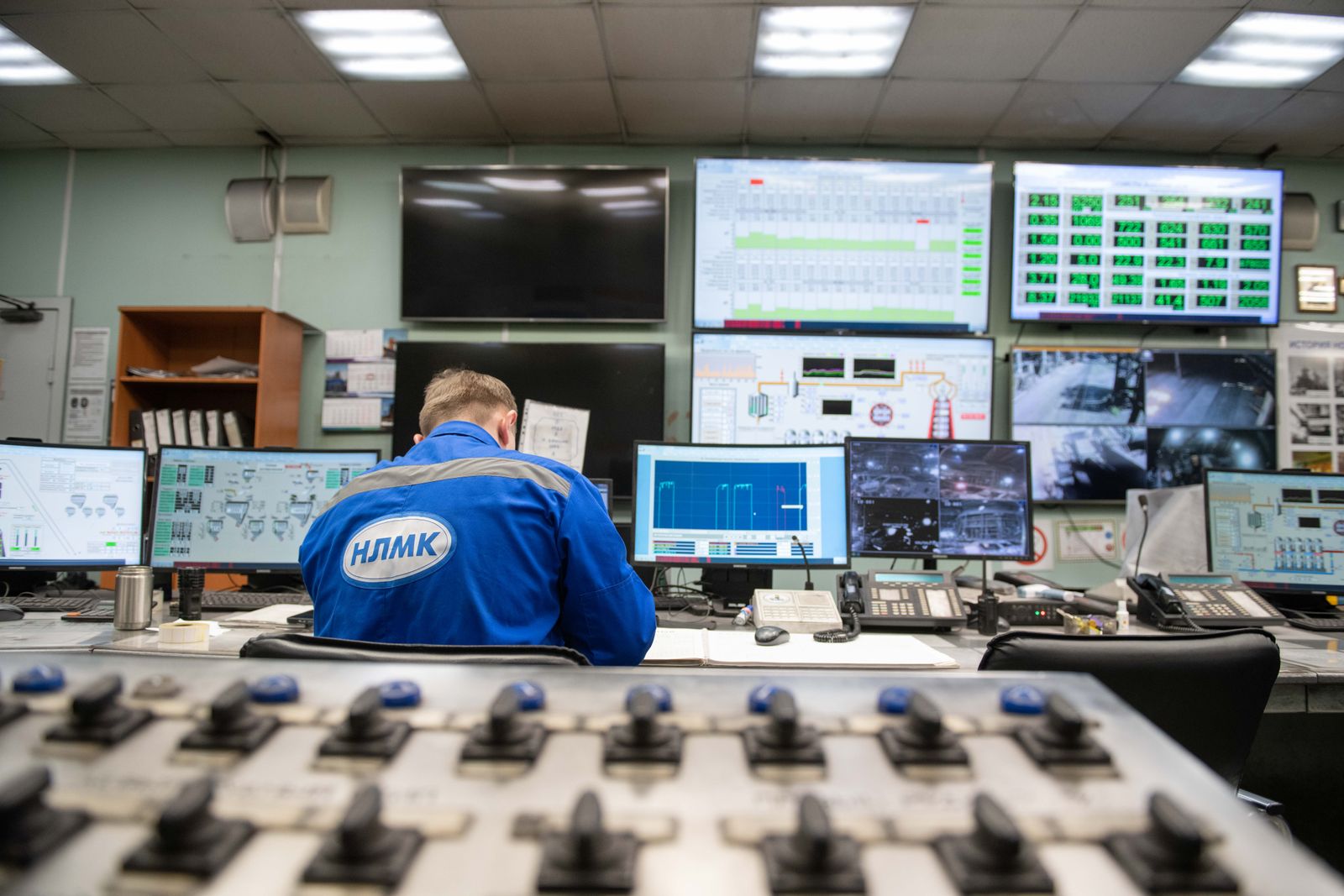 Engineer monitoring an industrial control room
